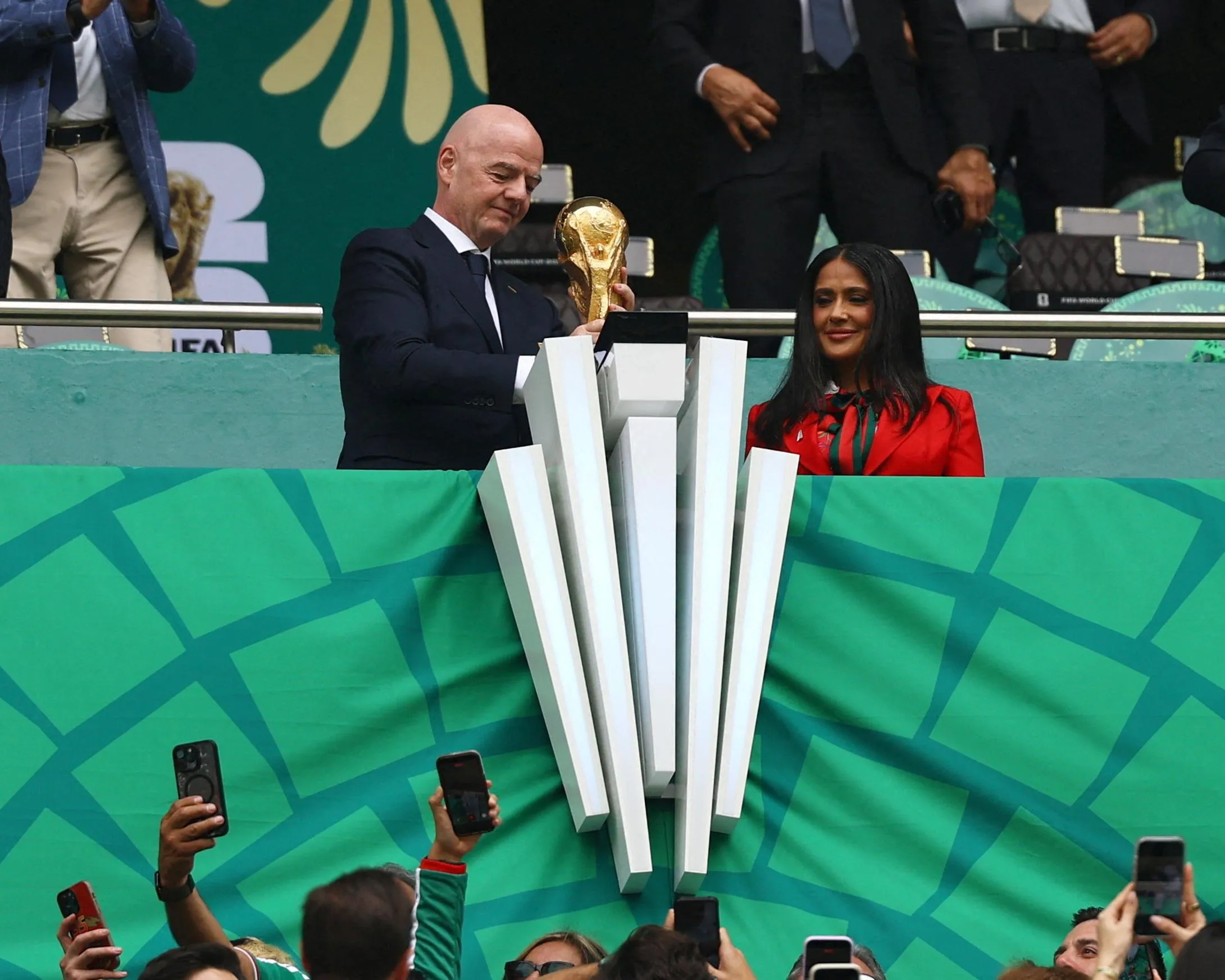Gianni Infantino holds the golden trophy