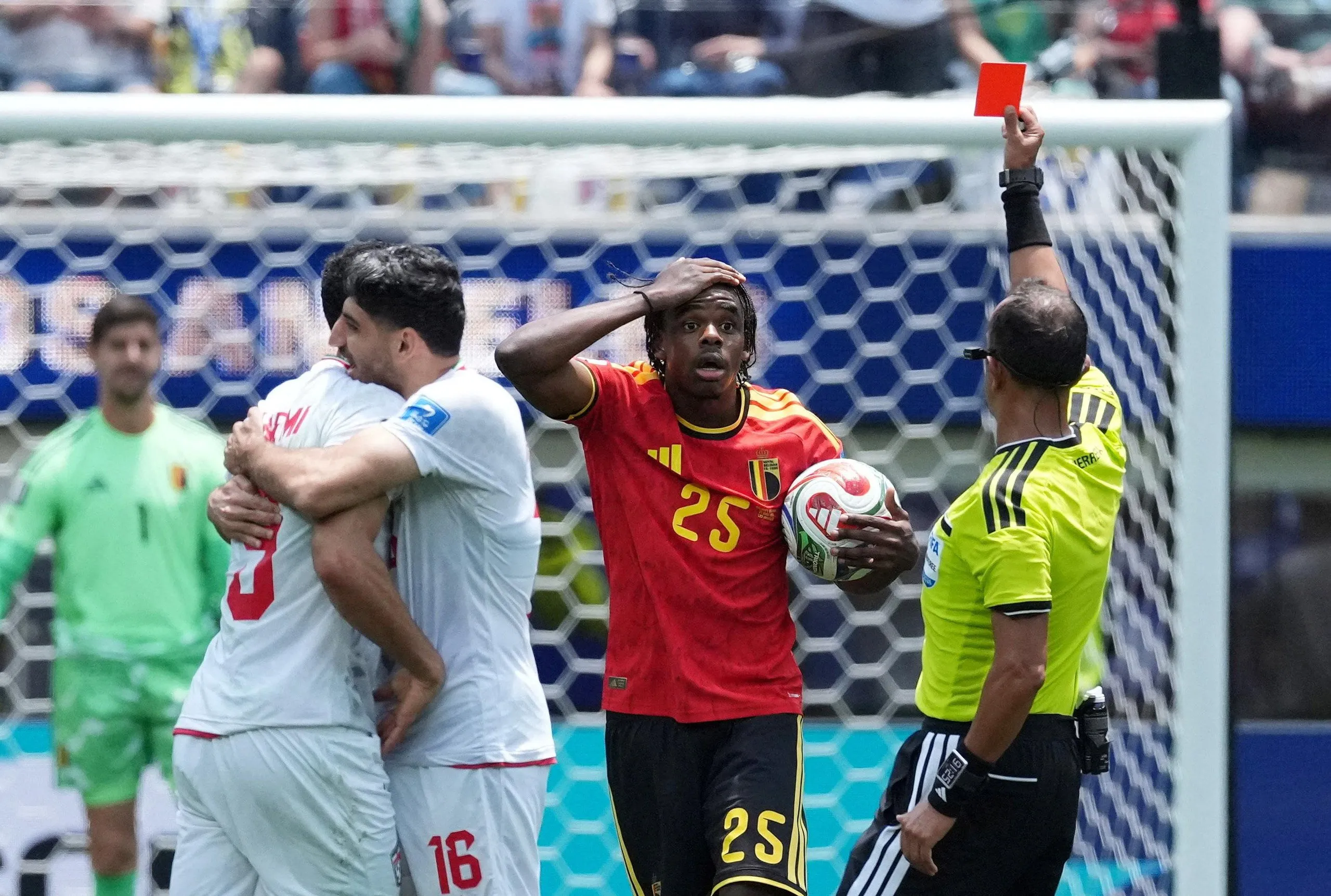 Belgium’s Nathan Ngoy is sent off against Iran