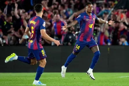 Marcus Rashford of Barcelona celebrates scoring his team’s first goal against Real Madrid with teammate Pau Cubarsí