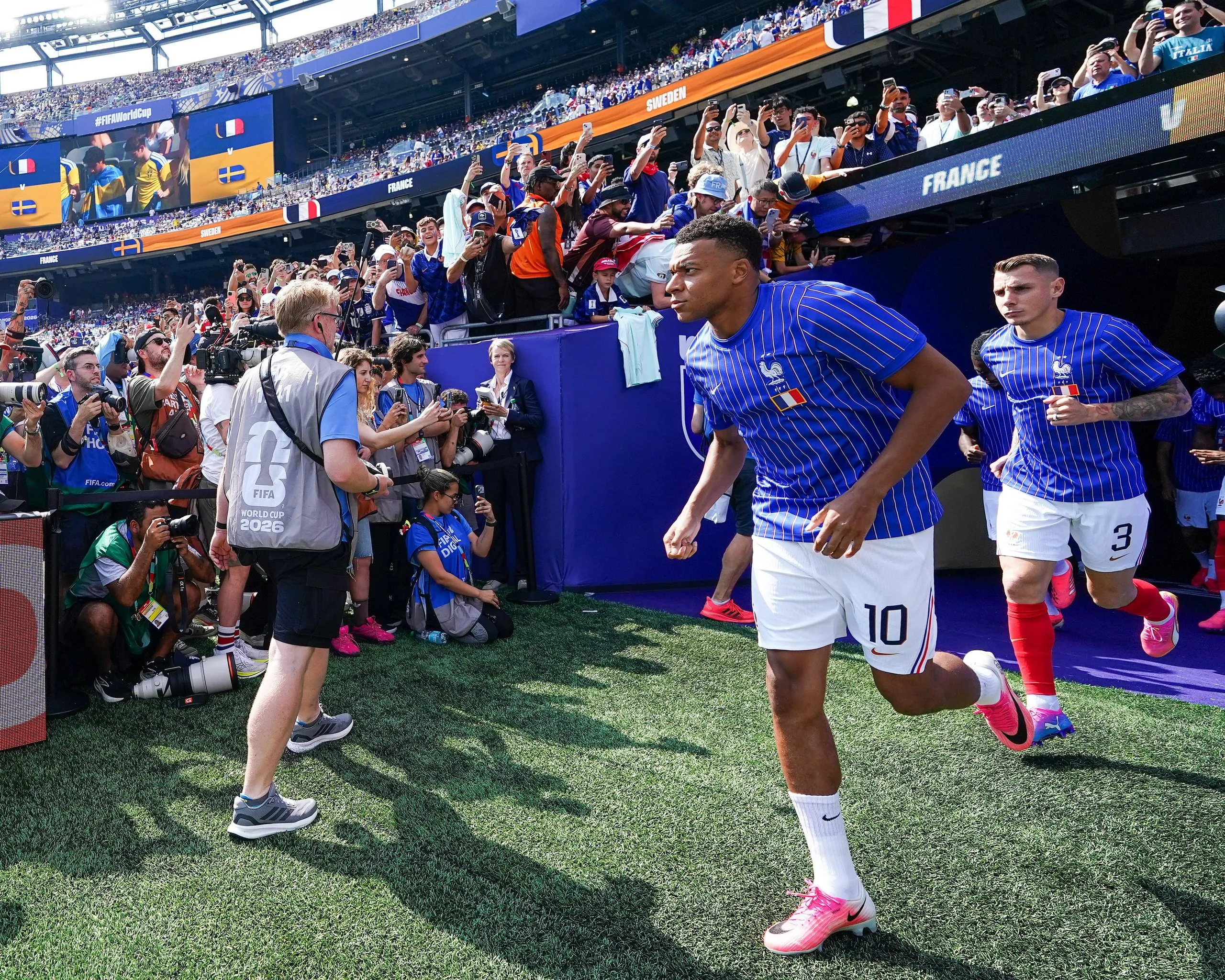 Kylian Mbappe jogs out to warm up.