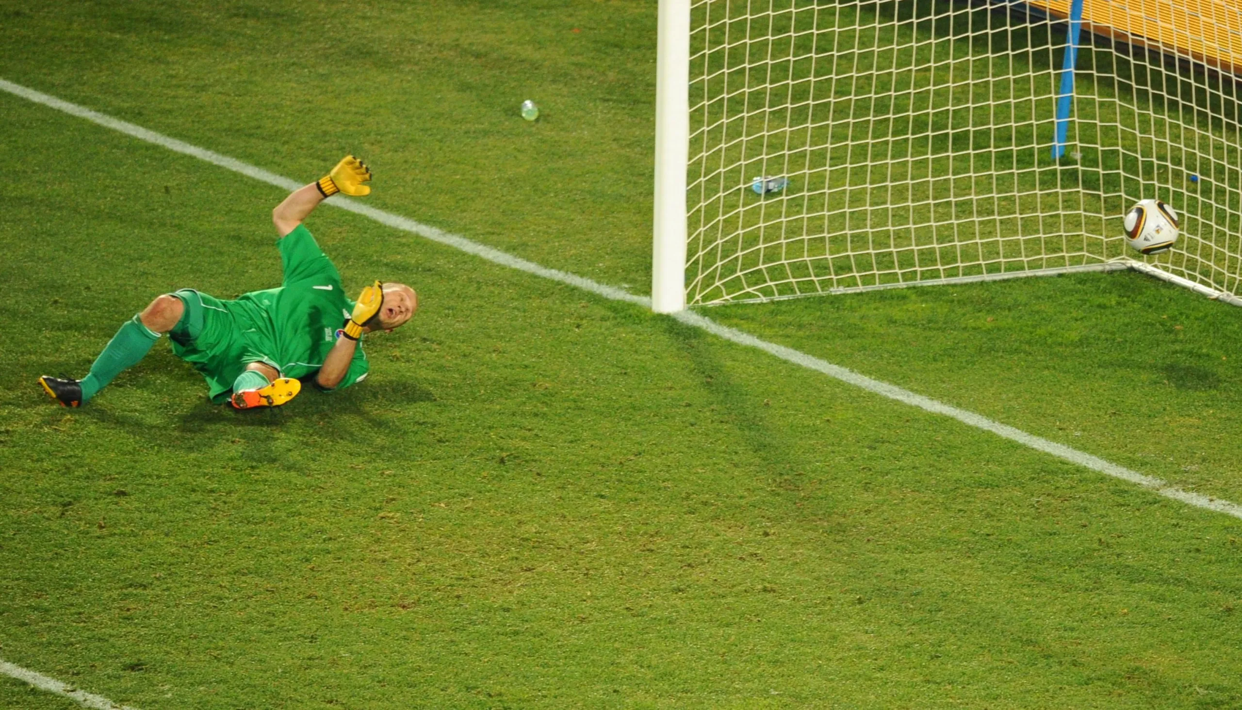 Slovakia’s goalkeeper Jan Mucha sprawls on the floor, with the ball in the net behind him, having been lobbed by Italian forward Fabio Quagliarella during their 2010 World Cup game in Johannesburg.