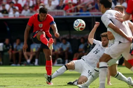 Jude Bellingham takes a shot for England during a friendly against New Zealand. Jude Bellingham shoots for England during a friendly against New Zealand.