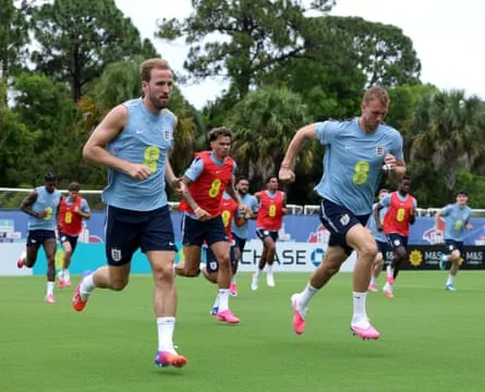 Harry Kane and Dan Burn take part in a running drill during a training session on Thursday