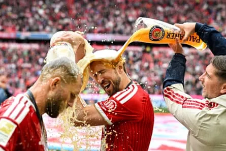 Harry Kane and his Bayern Munich teammates celebrate their Bundesliga win in May