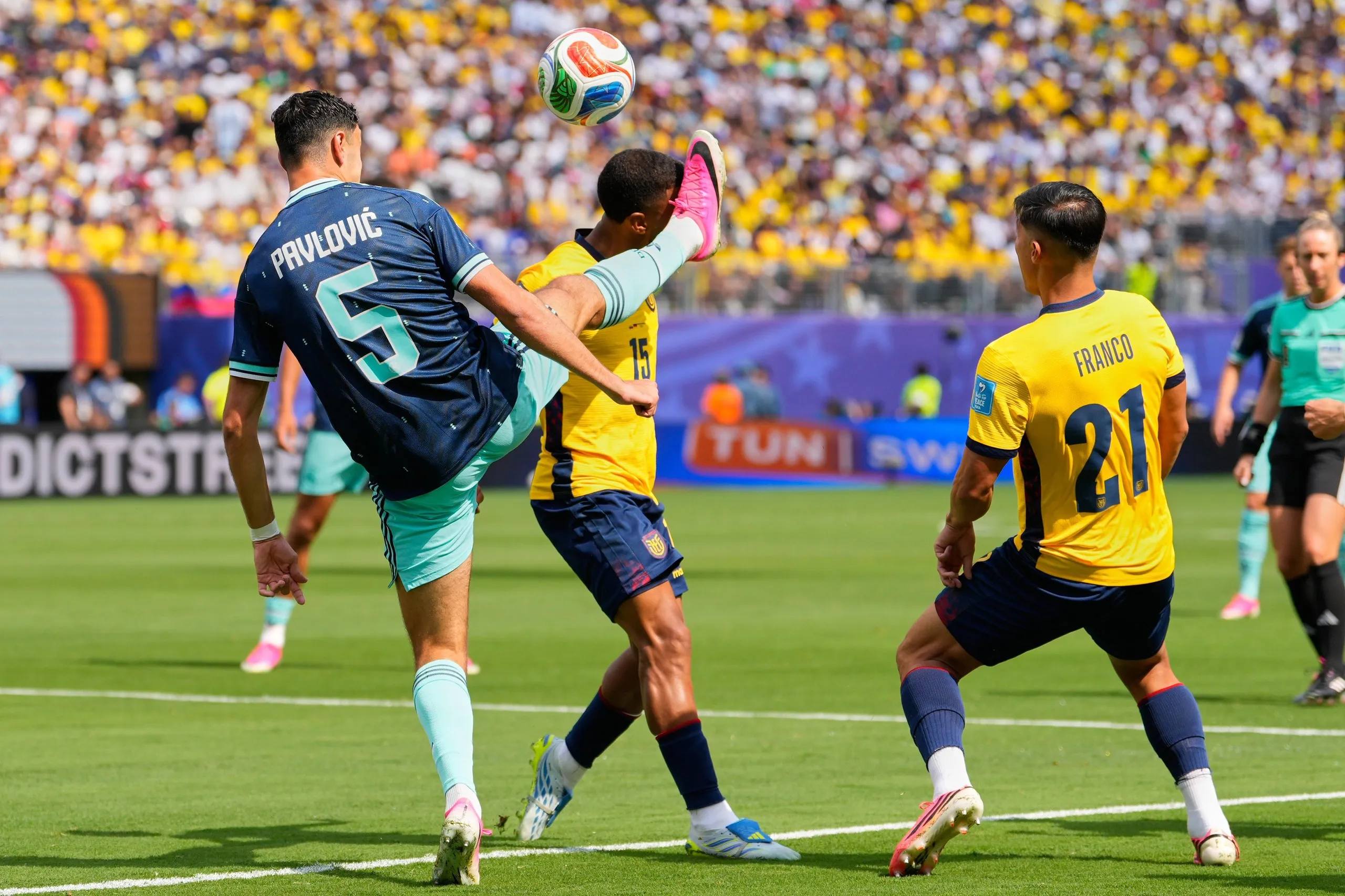 Germany’s Aleksandar Pavlovic (5) and Ecuador’s Pedro Vite battle for the ball