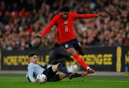 Marcus Rashford evades the challenge of Federico Valverde during the international friendly match between England and Uruguay at Wembley Stadium