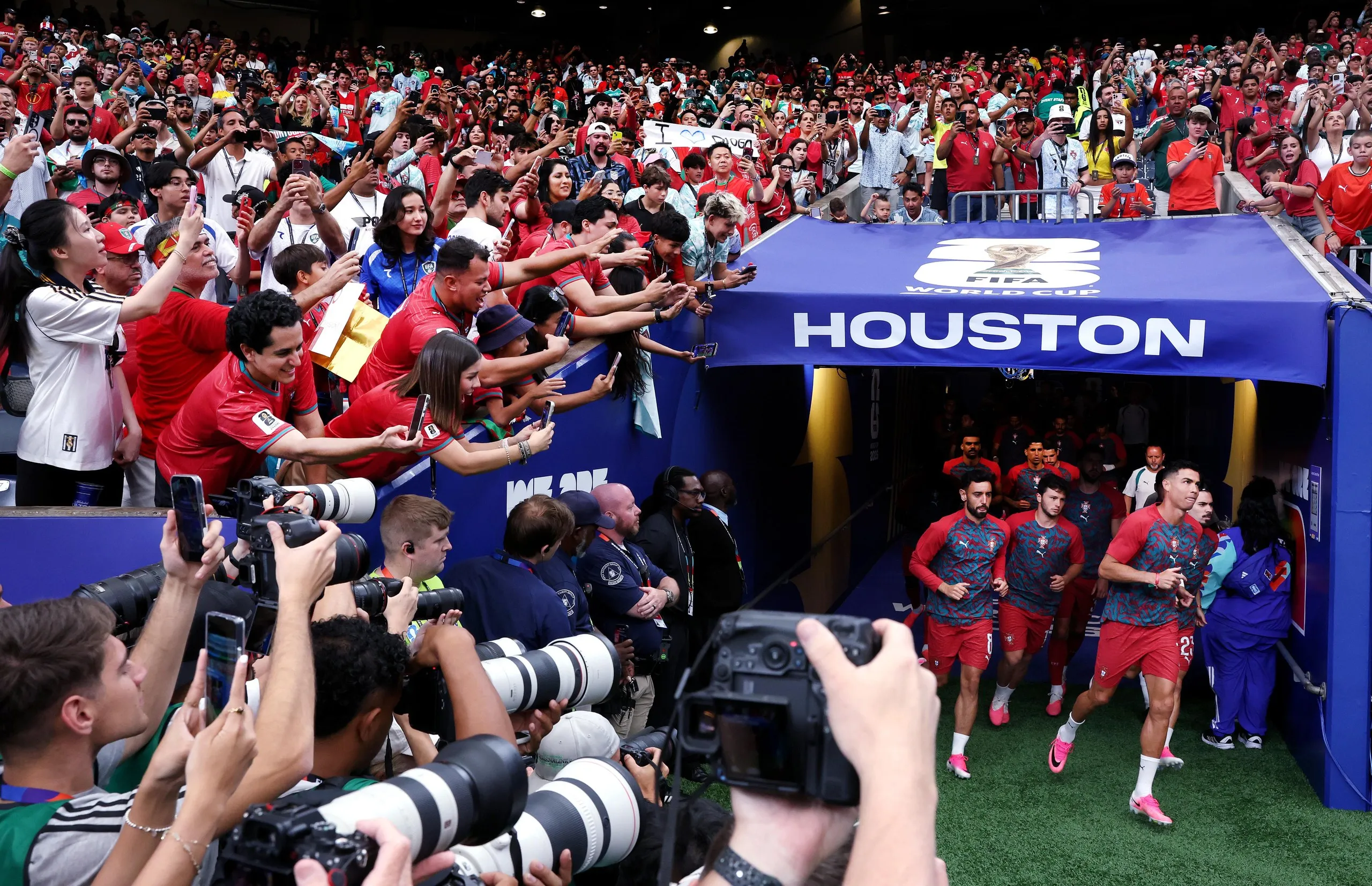Portugal captain Cristiano Ronaldo leads his team out for the warm up.