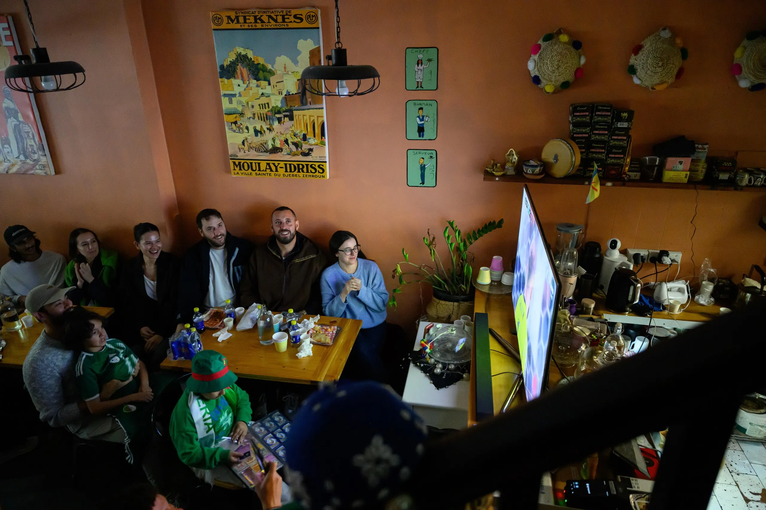 Algeria fans gather around the TV at Cafe Tanja on Sunday.