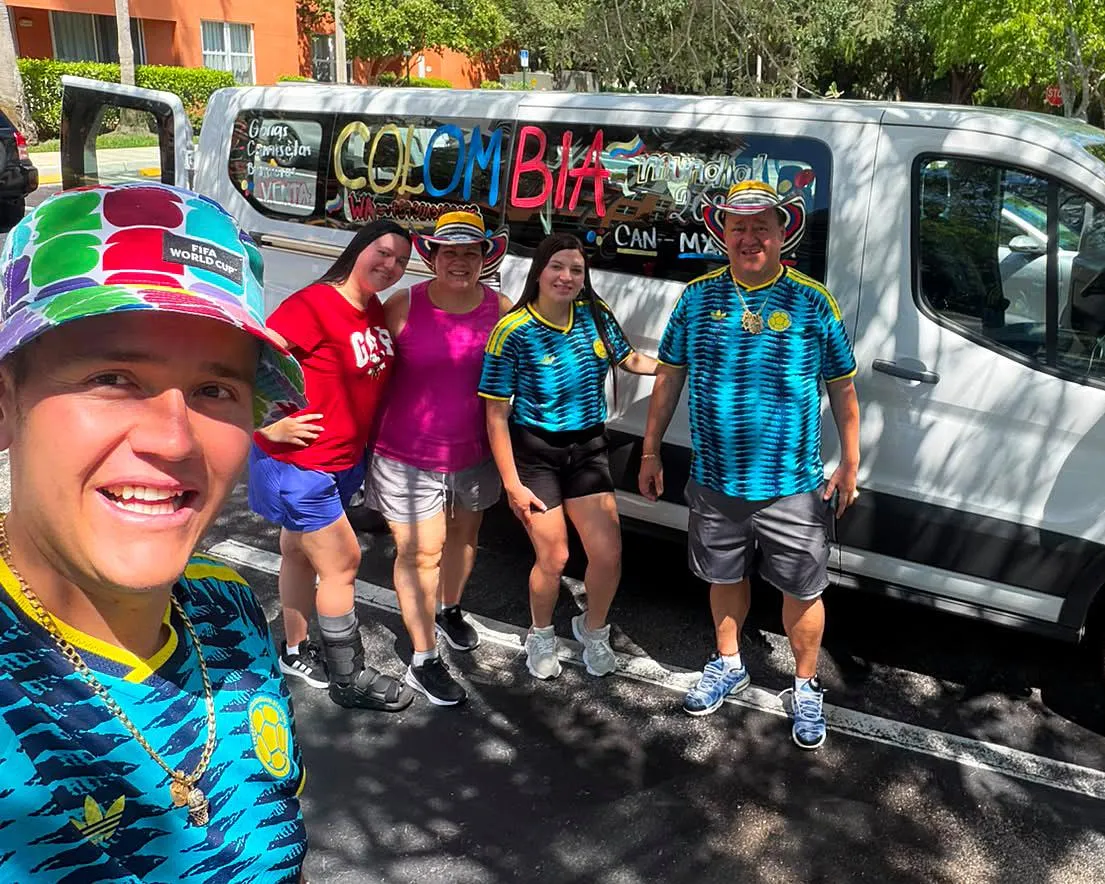 Juan Carlos Mila and his family with their mini van.