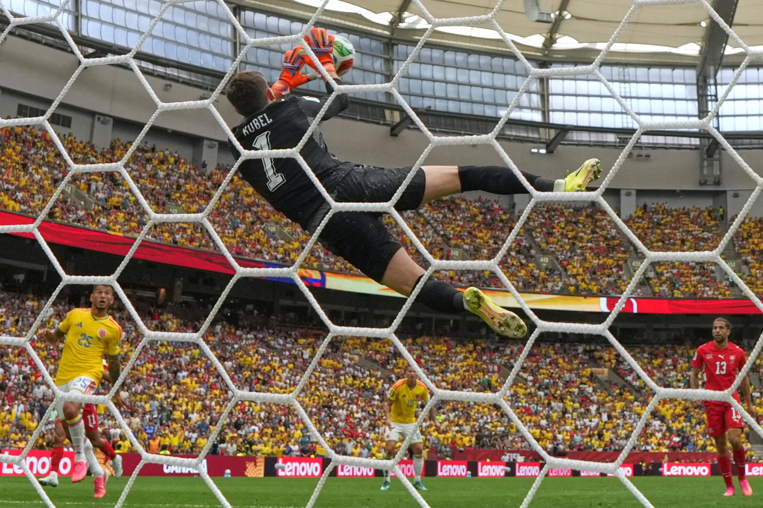 Switzerland’s Gregor Kobel makes a flying save.