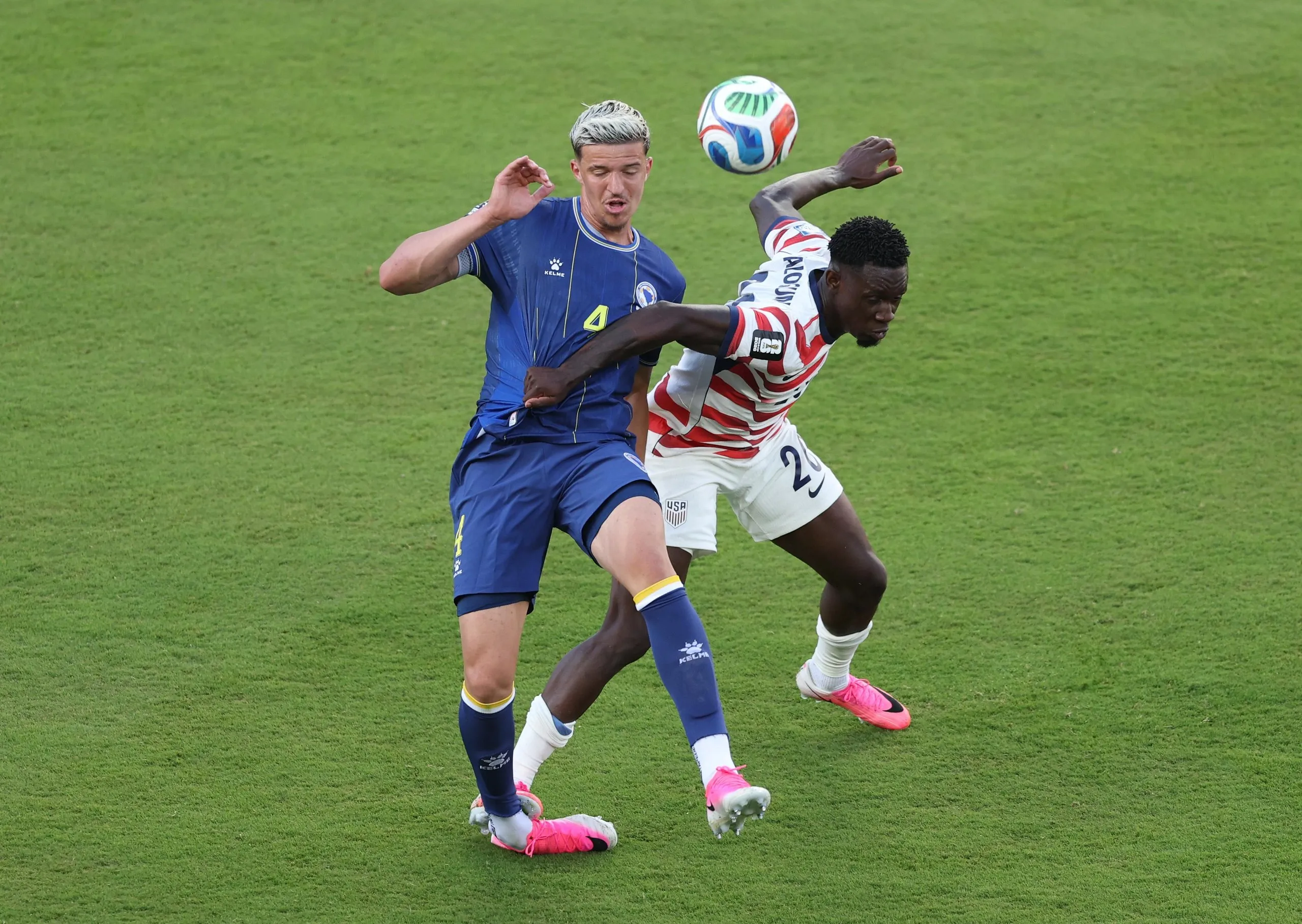 The USA’s Folarin Balogun fouls Tarik Muharemovic of Bosnia and Herzegovina