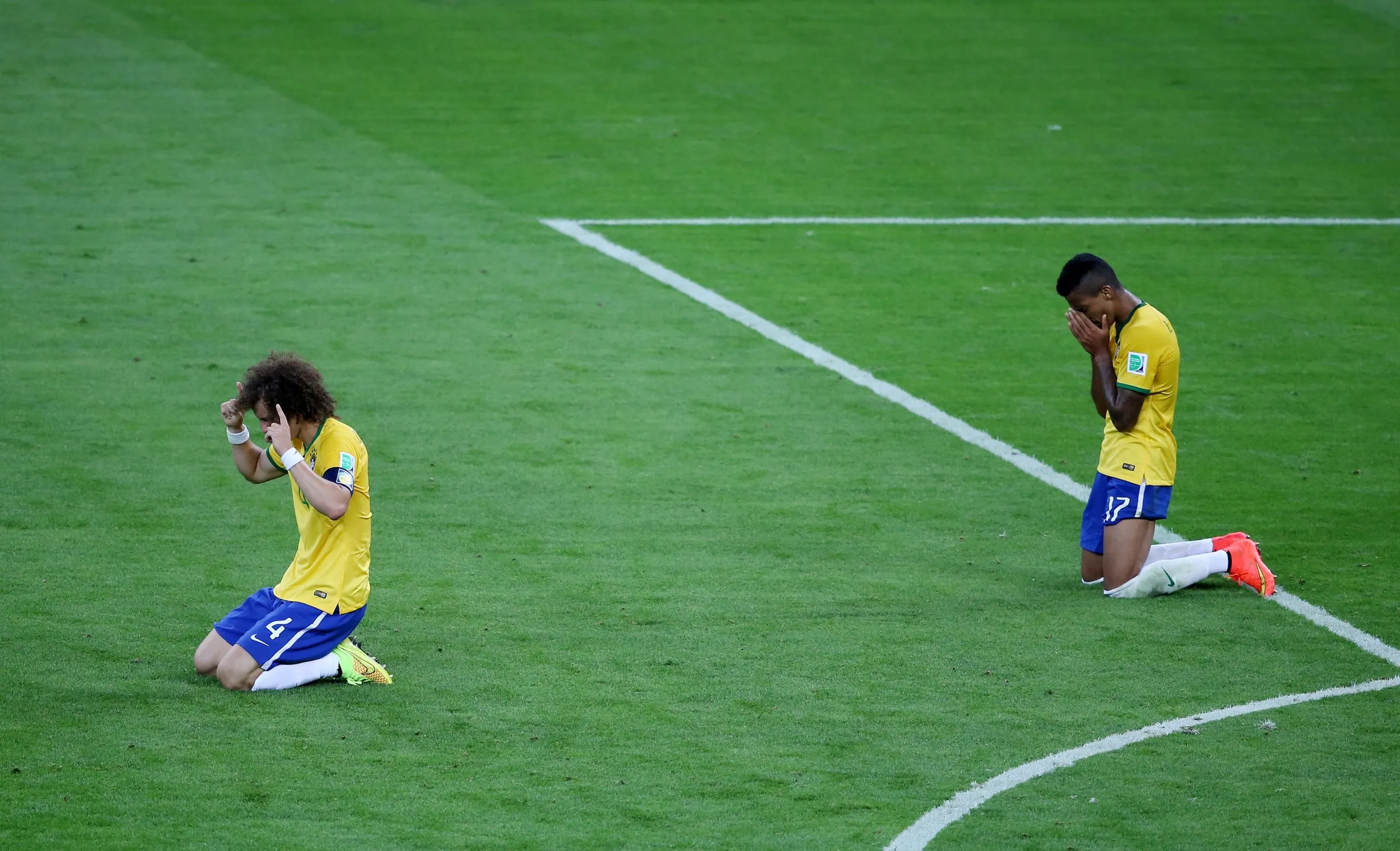 Brazil’s David Luiz (left) and Luiz Gustavo look dejected after their 7-1 semi-final humiliation at the hands of Germany in 2014.