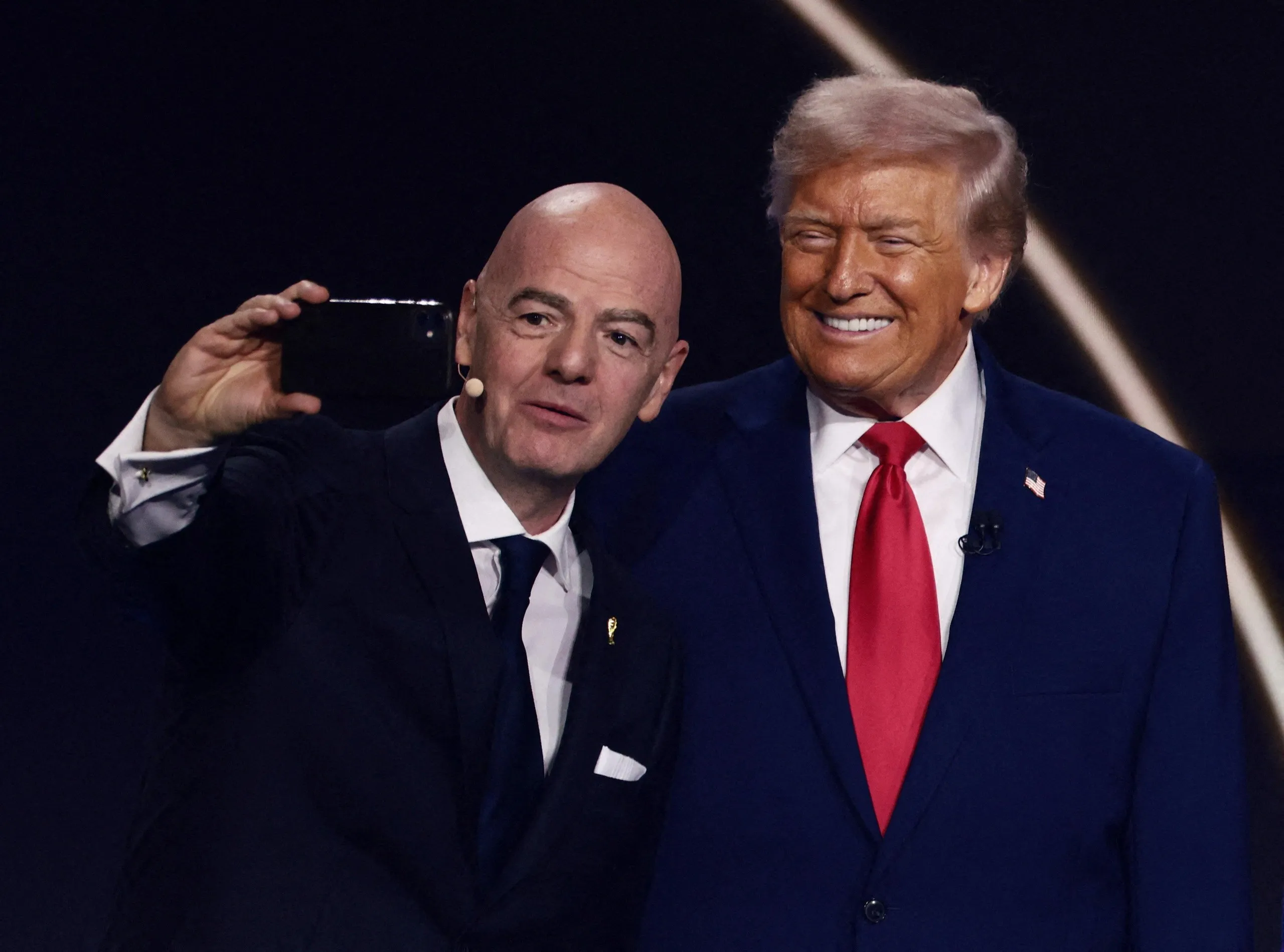 Fifa president Gianni Infantino takes a selfie with US president Donald Trump.