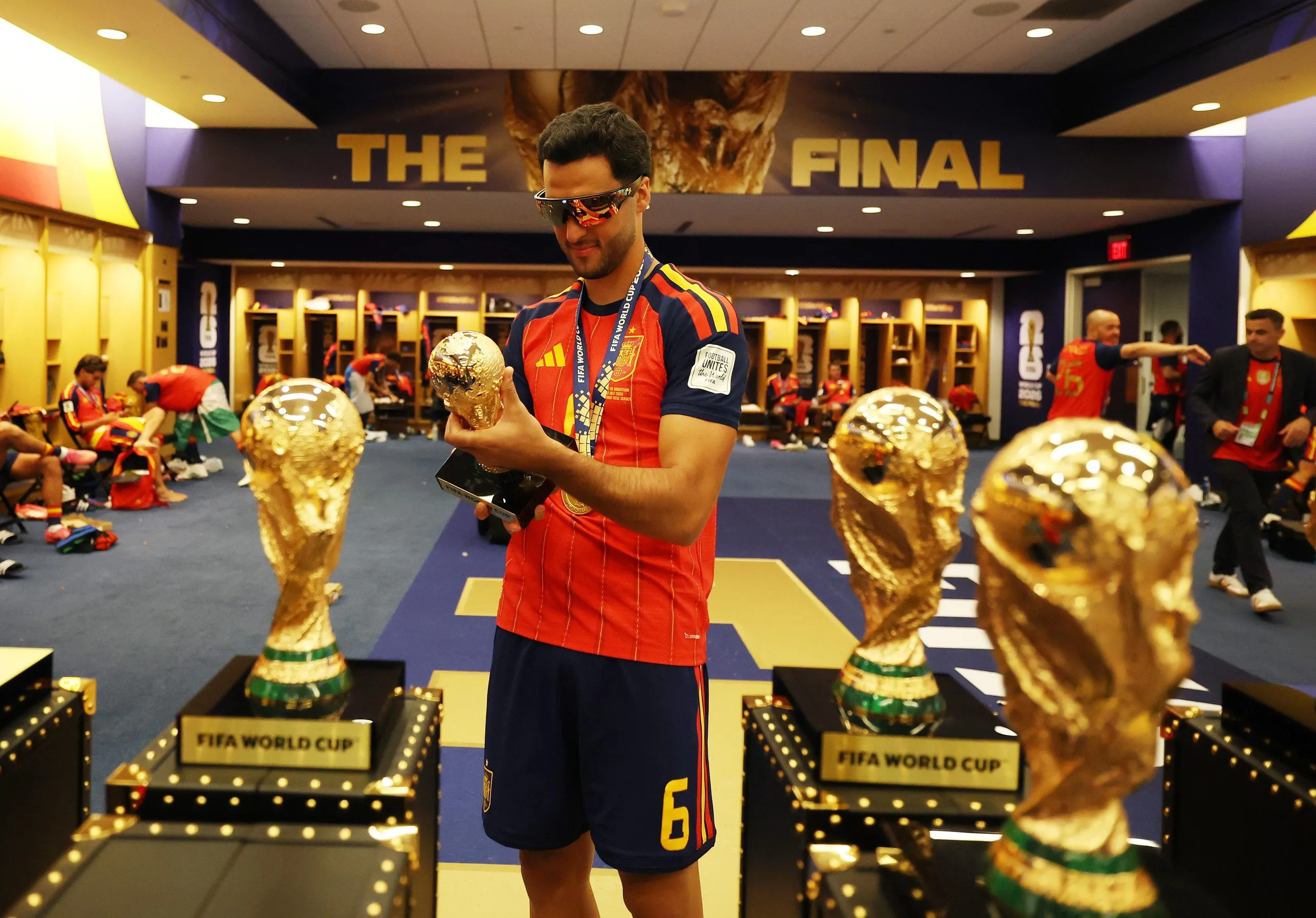Mikel Merino holds a replica of the trophy.