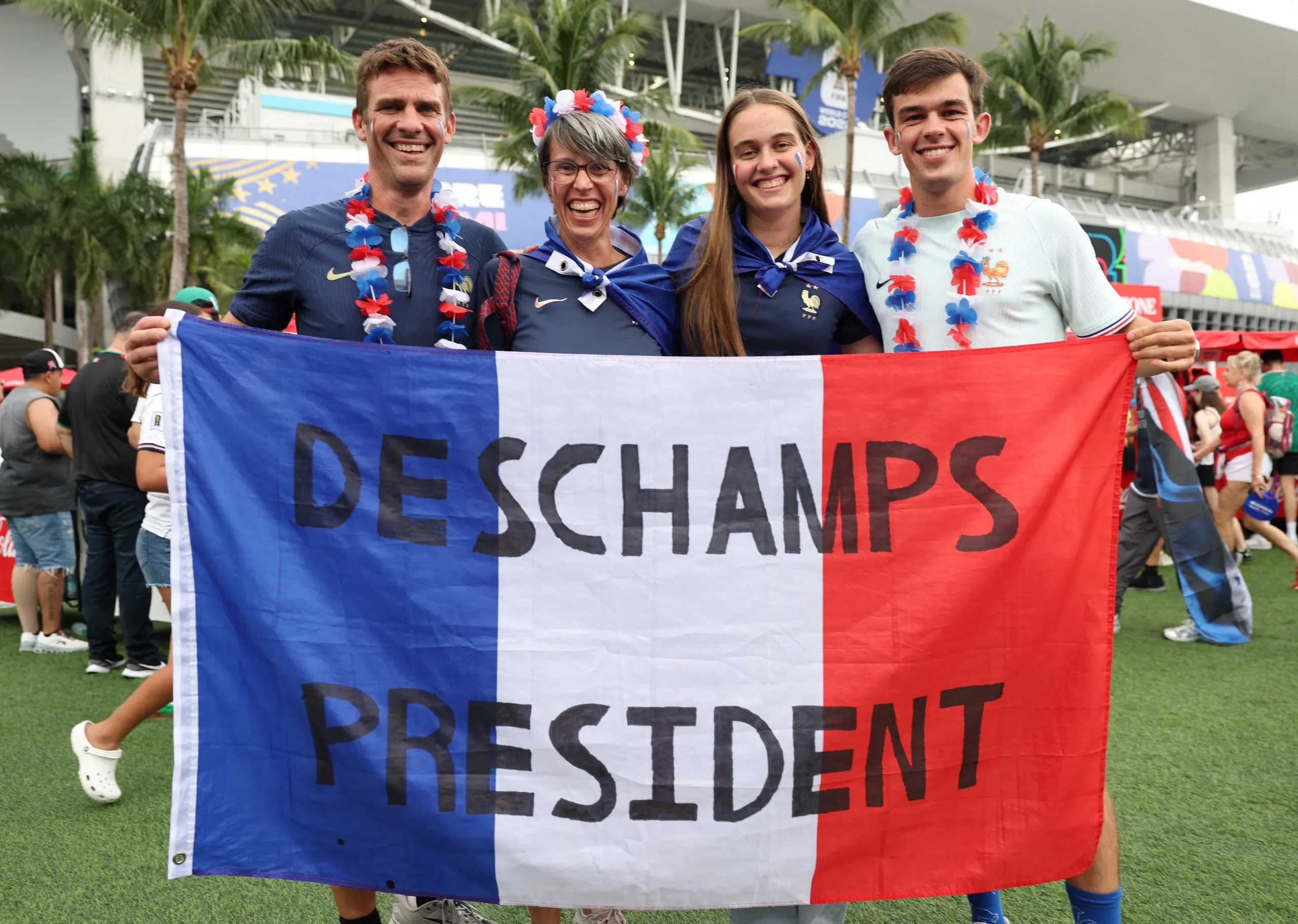 France fans hold up a sign in support of France coach Didier Deschamps outside the stadium before the England match.